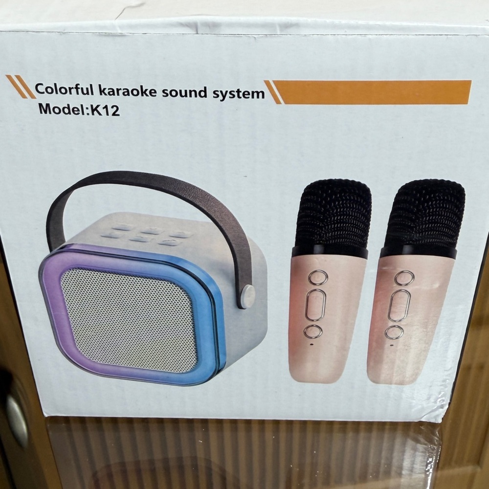 NIB Mini karaoke machine with two microphones. Beige color.